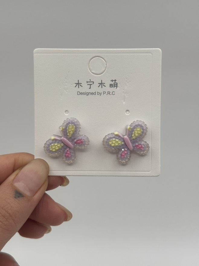 گوشواره فانتزی پروانه کریستالی بنفش کد 2205